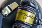 Whistleblower Law text engraved on Lawyer Gavel. Whistleblowing visual concept for a legal blog discussing Connecticut whistleblower laws.