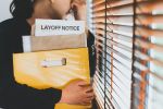 Female employee: stress and sadness after receiving a layoff notice. The impact of the economic recession and layoffs.